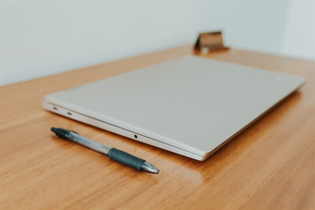 silver laptop used for online therapy in georgia